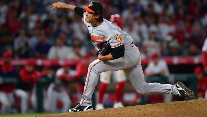Sep 5, 2023; Anaheim, California, USA; Baltimore Orioles relief pitcher Shintaro Fujinami (14) throws against the Los Angeles Angels during the tenth inning at Angel Stadium. Mandatory Credit: Gary A. Vasquez-USA TODAY Sports