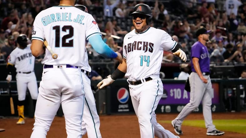 Arizona Diamondbacks Gabriel Moreno (14) scores on a 2-RBI-double by Jace Peterson (6) against the Colorado Rockies in the fourth inning at Chase Field in Phoenix on Sept. 4, 2023.