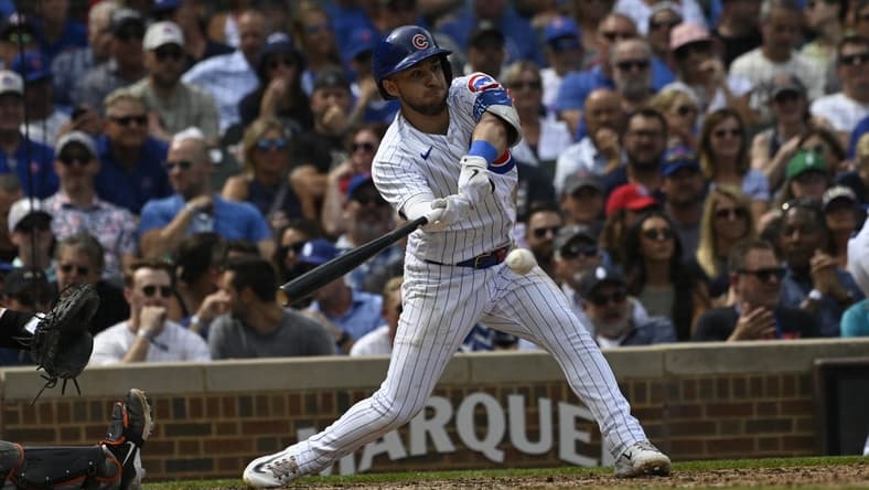 Sep 6, 2023; Chicago, Illinois, USA;  Chicago Cubs third baseman Nick Madrigal (1) hits an RBI single against the San Francisco Giants during the third inning at Wrigley Field. Mandatory Credit: Matt Marton-USA TODAY Sports