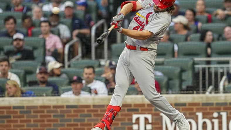 Sep 6, 2023; Cumberland, Georgia, USA; St. Louis Cardinals designated hitter Alec Burleson (41) singles before being thrown out trying to stretch to a double second baseman Nolan Gorman (16) against the Atlanta Braves during the first inning at Truist Park. Mandatory Credit: Dale Zanine-USA TODAY Sports