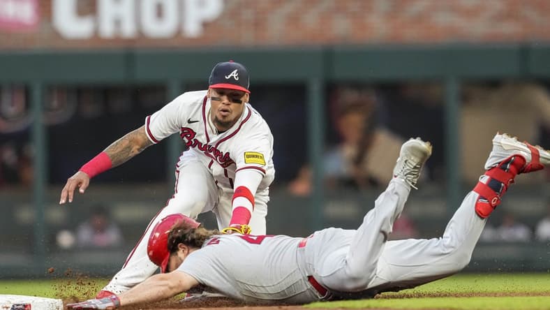 Sep 6, 2023; Cumberland, Georgia, USA; Atlanta Braves shortstop Orlando Arcia (11) tags out St. Louis Cardinals designated hitter Alec Burleson (41) at second base during the first inning at Truist Park. Mandatory Credit: Dale Zanine-USA TODAY Sports