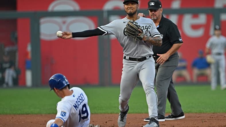 Sep 6, 2023; Kansas City, Missouri, USA; Chicago White Sox second baseman Lenyn Sosa (50) throws the ball to first base for a double play over Kansas City Royals Michael Massey (19) in the second inning at Kauffman Stadium. Mandatory Credit: Peter Aiken-USA TODAY Sports