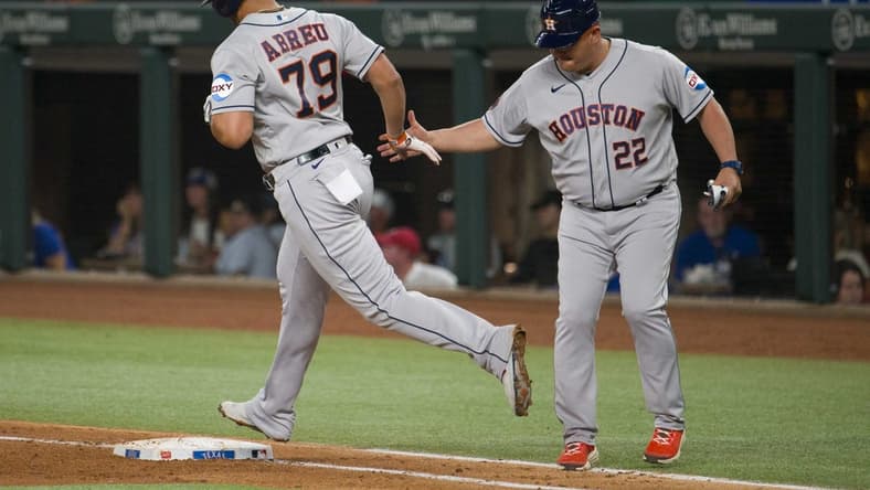 Sep 6, 2023; Arlington, Texas, USA; Houston Astros first baseman Jose Abreu (79) rounds first base past first base coach Omar L pez (22) after Abreu hits a grand slam home run against the Texas Rangers during the third inning at Globe Life Field. Mandatory Credit: Jerome Miron-USA TODAY Sports