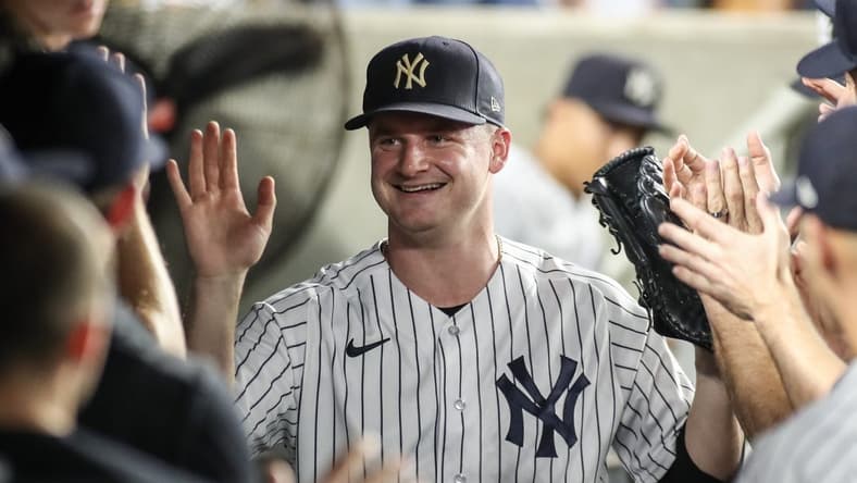 Sep 6, 2023; Bronx, New York, USA; New York Yankees starting pitcher Clarke Schmidt (36) is greeted in the dugout after being taken out in the seventh inning against the Detroit Tigers at Yankee Stadium. Mandatory Credit: Wendell Cruz-USA TODAY Sports