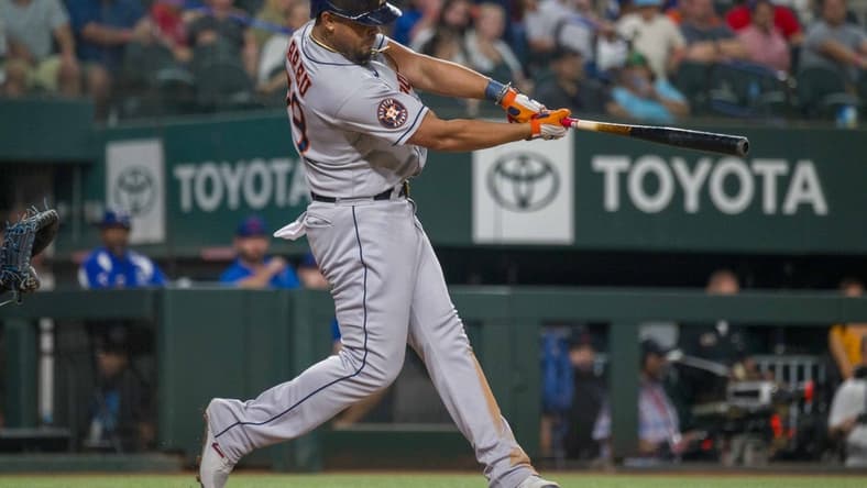 Sep 6, 2023; Arlington, Texas, USA; Houston Astros first baseman Jose Abreu (79) hits a three run home run against the Texas Rangers during the ninth inning at Globe Life Field. Mandatory Credit: Jerome Miron-USA TODAY Sports