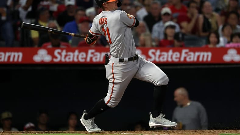 Sep 6, 2023; Anaheim, California, USA; Baltimore Orioles left fielder Austin Hays (21) hits an RBI single during the third inning against the Los Angeles Angels at Angel Stadium. Mandatory Credit: Kiyoshi Mio-USA TODAY Sports