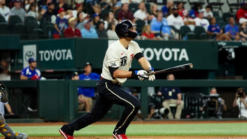 Sep 8, 2023; Arlington, Texas, USA;  Texas Rangers shortstop Corey Seager (5) hits a two-run home run during the first inning against the Oakland Athletics at Globe Life Field. Mandatory Credit: Kevin Jairaj-USA TODAY Sports