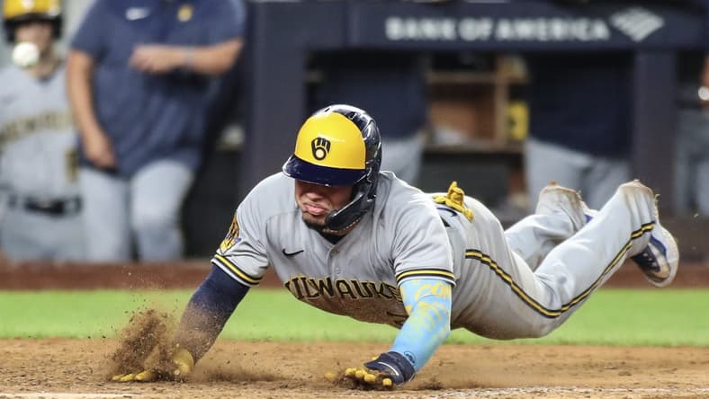 Sep 8, 2023; Bronx, New York, USA;  Milwaukee Brewers catcher William Contreras (24) slides safely at home in the seventh inning against the New York Yankees at Yankee Stadium. Mandatory Credit: Wendell Cruz-USA TODAY Sports