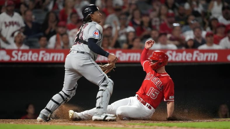 Sep 8, 2023; Anaheim, California, USA; Los Angeles Angels left fielder Randal Grichuk (15) slides into home plate to beat a throw to Cleveland Guardians catcher Bo Naylor (23) to score in the fourth inning at Angel Stadium. Mandatory Credit: Kirby Lee-USA TODAY Sports