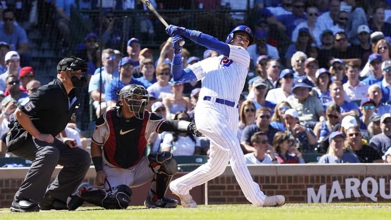Sep 9, 2023; Chicago, Illinois, USA; Chicago Cubs first baseman Cody Bellinger (24) hits a RBI single against the Arizona Diamondbacks during the third inningat Wrigley Field. Mandatory Credit: David Banks-USA TODAY Sports
