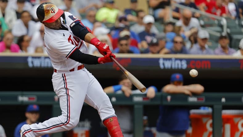 Sep 9, 2023; Minneapolis, Minnesota, USA; Minnesota Twins first baseman Donovan Solano (39) hits a two-run single against the New York Mets in the second inning at Target Field. Mandatory Credit: Bruce Kluckhohn-USA TODAY Sports