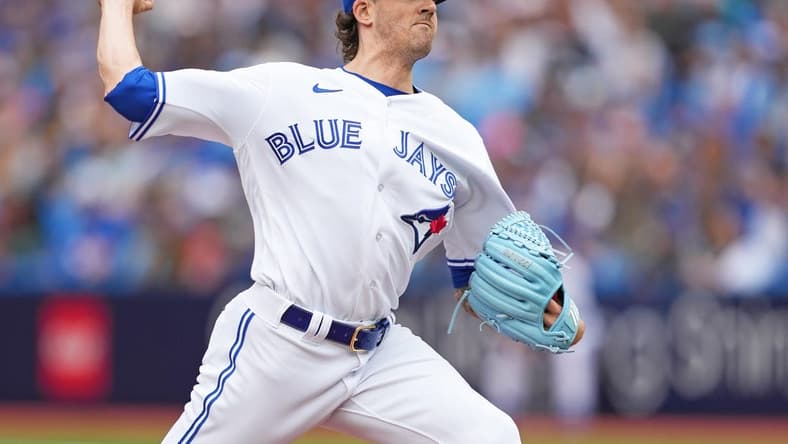 Sep 9, 2023; Toronto, Ontario, CAN; Toronto Blue Jays starting pitcher Kevin Gausman (34) pitches against the Kansas City Royals during the first inning at Rogers Centre. Mandatory Credit: Nick Turchiaro-USA TODAY Sports