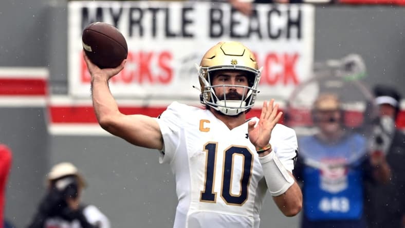 Sep 9, 2023; Raleigh, North Carolina, USA;Notre Dame Fighting Irish quarterback Sam Hartman (10) throws a pass during the first half against the North Carolina State Wolfpack at Carter-Finley Stadium. Mandatory Credit: Rob Kinnan-USA TODAY Sports