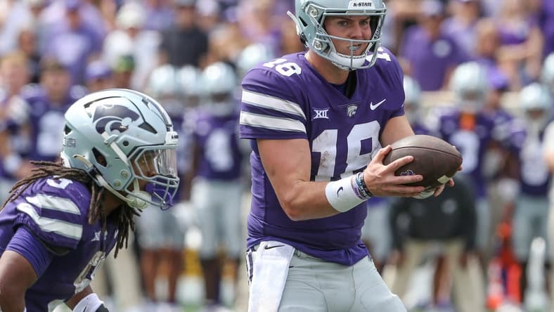 Sep 9, 2023; Manhattan, Kansas, USA; Kansas State Wildcats quarterback Will Howard (18) fakes a handoff to wide receiver RJ Garcia II (3) during the fourth quarter against the Troy Trojans at Bill Snyder Family Football Stadium. Mandatory Credit: Scott Sewell-USA TODAY Sports