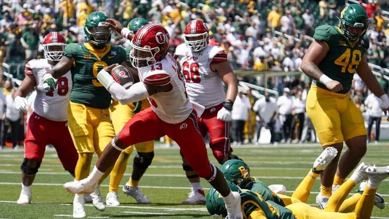 Sep 9, 2023; Waco, Texas, USA; Utah Utes quarterback Nate Johnson (13) carries the ball for a 11-yard touchdown against the Baylor Bears during the second half at McLane Stadium. Mandatory Credit: Raymond Carlin III-USA TODAY Sports