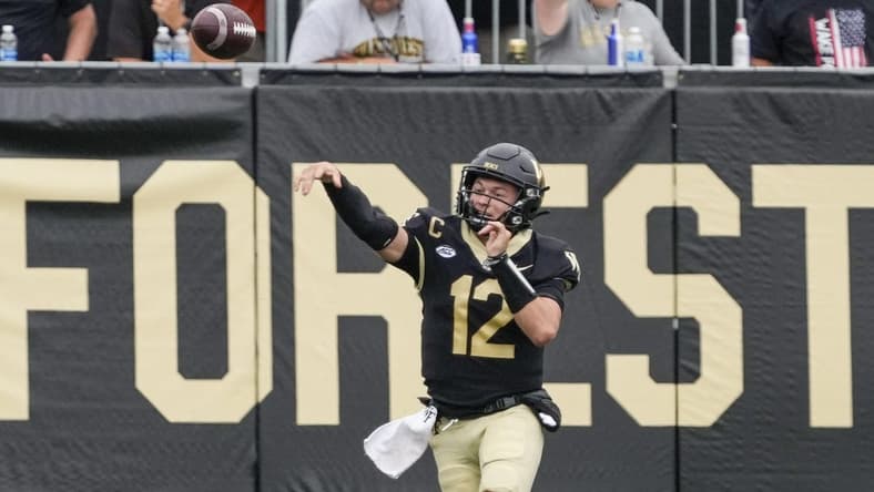 Sep 9, 2023; Winston-Salem, North Carolina, USA; Wake Forest Demon Deacons quarterback Mitch Griffis (12) passes near the end zone during the second half against the Vanderbilt Commodores at Allegacy Federal Credit Union Stadium. Mandatory Credit: Jim Dedmon-USA TODAY Sports