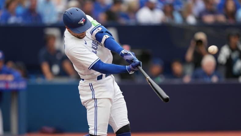 Sep 9, 2023; Toronto, Ontario, CAN; Toronto Blue Jays right fielder George Springer (4) hits a home run against the Kansas City Royals during the seventh inning at Rogers Centre. Mandatory Credit: Nick Turchiaro-USA TODAY Sports