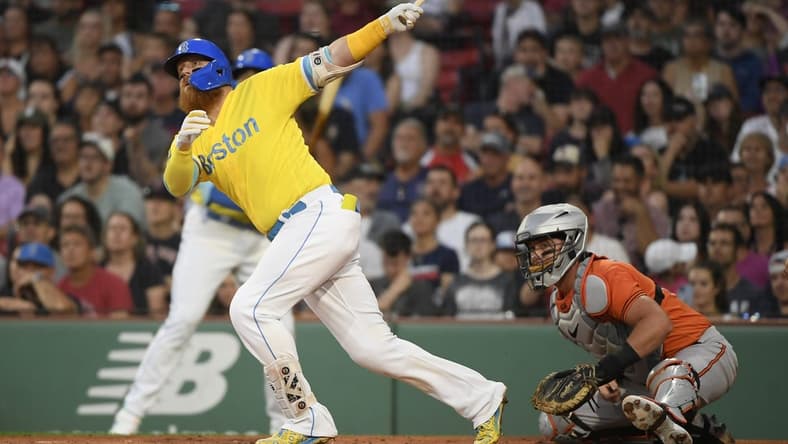Sep 9, 2023; Boston, Massachusetts, USA;  Boston Red Sox designated hitter Justin Turner (2) hits a two run home run during the first inning against the Baltimore Orioles at Fenway Park. Mandatory Credit: Bob DeChiara-USA TODAY Sports