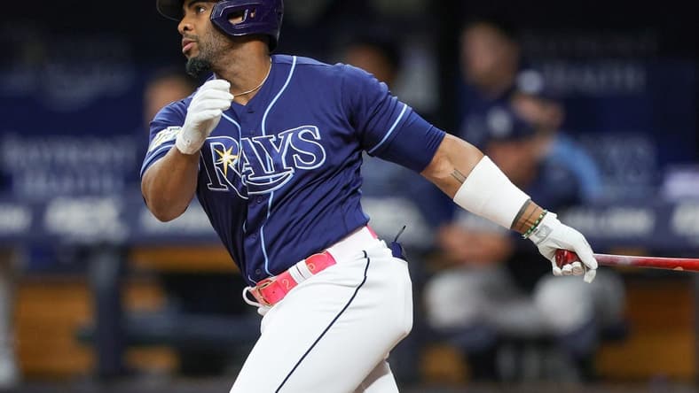 Sep 9, 2023; St. Petersburg, Florida, USA;  Tampa Bay Rays first baseman Yandy Diaz (2) hits an rbi double against the Seattle Mariners in the seventh inning at Tropicana Field. Mandatory Credit: Nathan Ray Seebeck-USA TODAY Sports