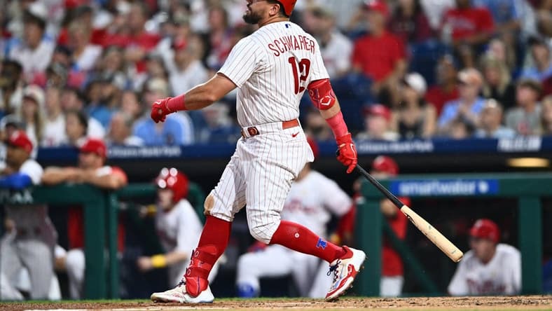 Sep 9, 2023; Philadelphia, Pennsylvania, USA; Philadelphia Phillies outfielder Kyle Schwarber (12) hits a three-run home run against the Miami Marlins in the second inning at Citizens Bank Park. Mandatory Credit: Kyle Ross-USA TODAY Sports