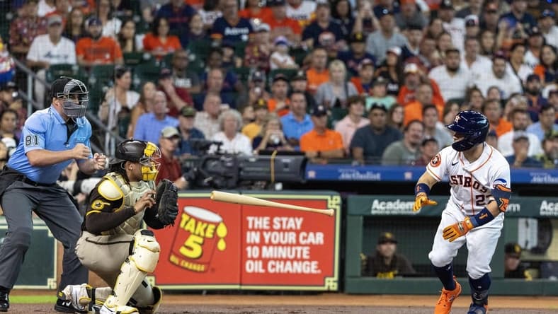 Sep 9, 2023; Houston, Texas, USA; Houston Astros second baseman Jose Altuve (27) throws his bat after he thought he was walked. Instead home plate umpire Quinn Wolcott called him out on strikes in the first inning at Minute Maid Park. Mandatory Credit: Thomas Shea-USA TODAY Sports