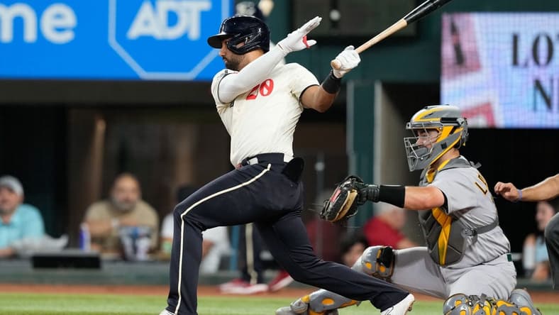 Sep 9, 2023; Arlington, Texas, USA; Texas Rangers left fielder Ezequiel Duran (20) singles against the Oakland Athletics during the second inning at Globe Life Field. Mandatory Credit: Jim Cowsert-USA TODAY Sports