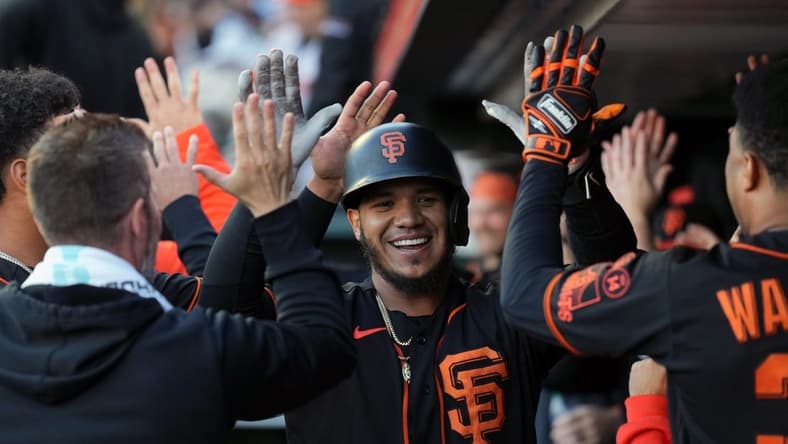 Sep 9, 2023; San Francisco, California, USA; San Francisco Giants second baseman Thairo Estrada (center) is congratulated by teammates after hitting a home run against the Colorado Rockies during the first inning at Oracle Park. Mandatory Credit: Darren Yamashita-USA TODAY Sports