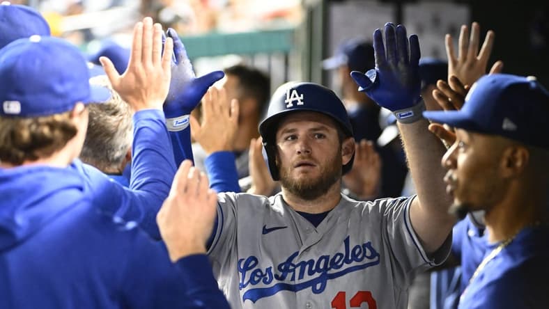 Sep 9, 2023; Washington, District of Columbia, USA; Los Angeles Dodgers third baseman Max Muncy (13) is congratulated by teammates after hitting a two run home run against the Washington Nationals during the eighth inning at Nationals Park. Mandatory Credit: Brad Mills-USA TODAY Sports