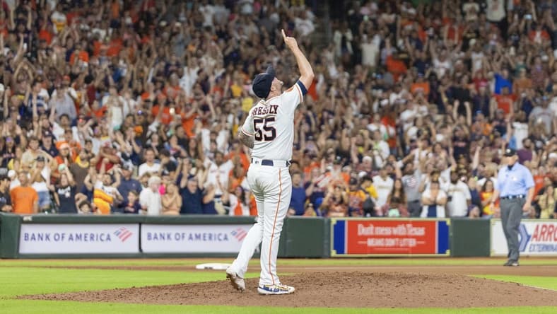 Sep 9, 2023; Houston, Texas, USA; Houston Astros relief pitcher Ryan Pressly (55) celebrates the win after defeating the San Diego Padres at Minute Maid Park. Mandatory Credit: Thomas Shea-USA TODAY Sports