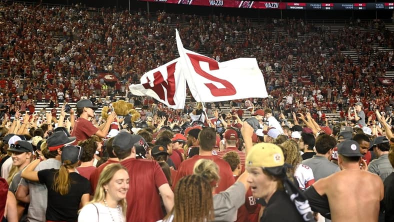 Sep 9, 2023; Pullman, Washington, USA; Washington State Cougars fans rush there field after a game against the Wisconsin Badgers at Gesa Field at Martin Stadium. Washington State won 31-22. Mandatory Credit: James Snook-USA TODAY Sports