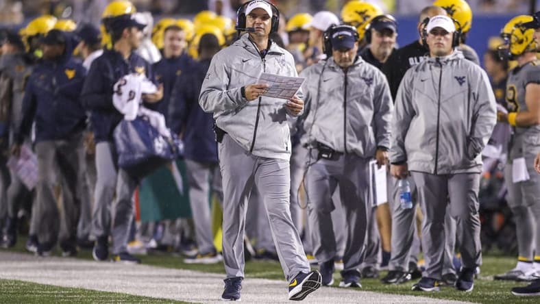 Sep 9, 2023; Morgantown, West Virginia, USA; West Virginia Mountaineers head coach Neal Brown walks long the sidelines during the second quarter against the Duquesne Dukes at Mountaineer Field at Milan Puskar Stadium. Mandatory Credit: Ben Queen-USA TODAY Sports