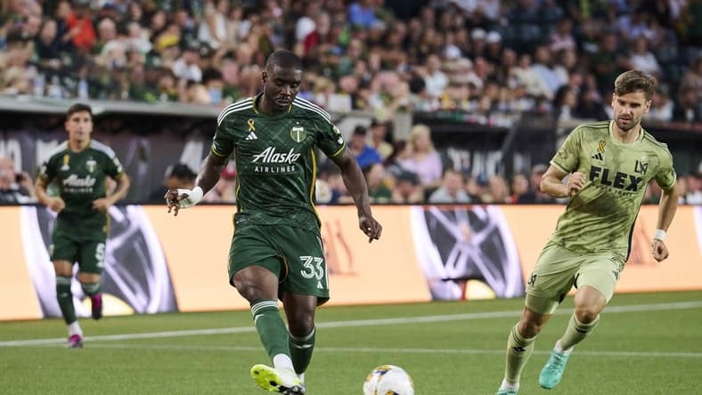 Sep 9, 2023; Portland, Oregon, USA; Portland Timbers defender Larrys Mabiala (33) kicks the ball during the first half against Los Angeles FC forward Mario Gonzalez (9) at Providence Park. Mandatory Credit: Troy Wayrynen-USA TODAY Sports