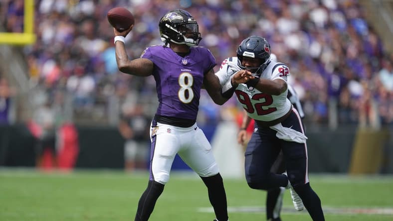 Sep 10, 2023; Baltimore, Maryland, USA; Baltimore Ravens quarterback Lamar Jackson (8) pressured by Houston Texans defensive end Dylan Horton (92) in the first quarter at M&T Bank Stadium. Mandatory Credit: Mitch Stringer-USA TODAY Sports
