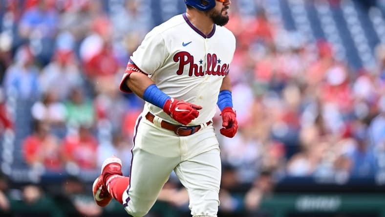 Sep 10, 2023; Philadelphia, Pennsylvania, USA; Philadelphia Phillies outfielder Kyle Schwarber (12) advances to first after hitting a single against the Miami Marlins in the first inning at Citizens Bank Park. Mandatory Credit: Kyle Ross-USA TODAY Sports