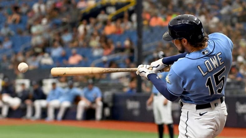 Sep 10, 2023; St. Petersburg, Florida, USA; Tampa Bay Rays right fielder Josh Lowe (15) hits a RBI double in the first inning against the Seattle Mariners at Tropicana Field. Mandatory Credit: Jonathan Dyer-USA TODAY Sports
