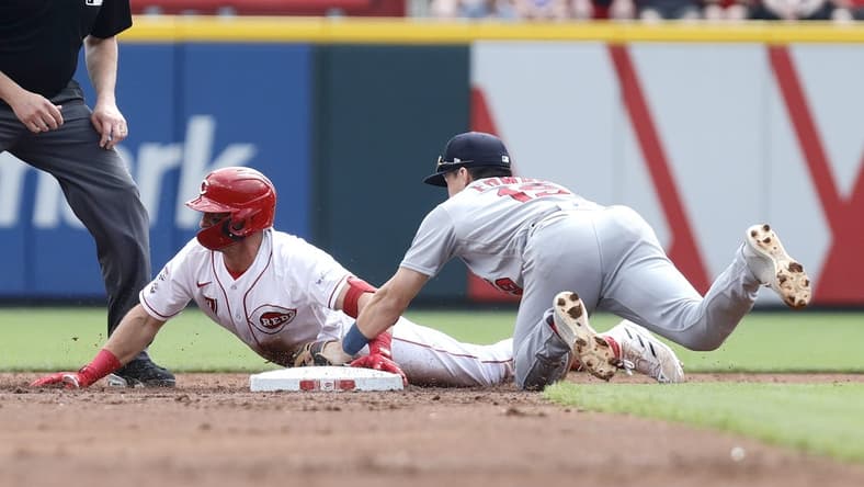 Sep 10, 2023; Cincinnati, Ohio, USA; Cincinnati Reds third baseman Spencer Steer (7) is tagged out at second base against St. Louis Cardinals second baseman Tommy Edman (19) during the second inning at Great American Ball Park. Mandatory Credit: David Kohl-USA TODAY Sports