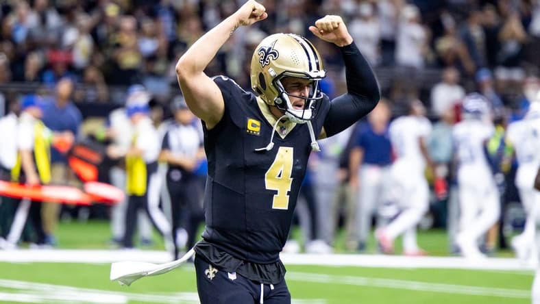 Sep 10, 2023; New Orleans, Louisiana, USA; New Orleans Saints quarterback Derek Carr (4) celebrate a touchdown pass to New Orleans Saints wide receiver Rashid Shaheed (22) against the Tennessee Titans during the second half at the Caesars Superdome. Mandatory Credit: Stephen Lew-USA TODAY Sports
