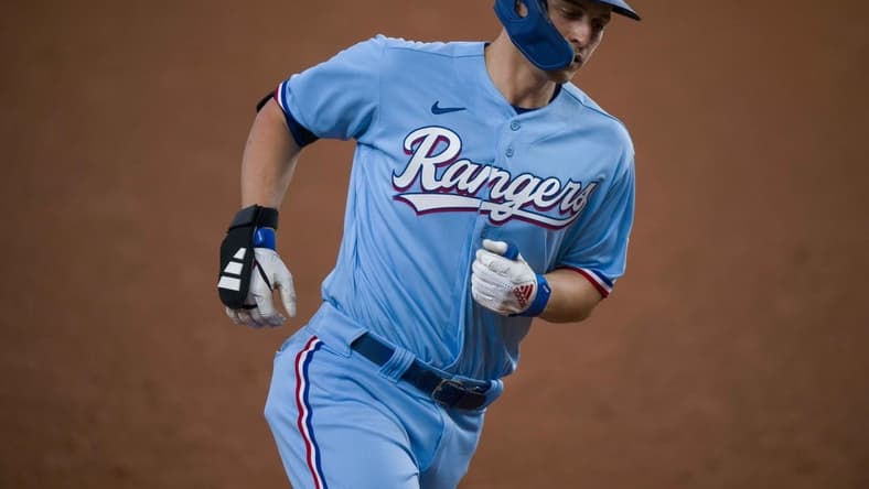 Sep 10, 2023; Arlington, Texas, USA; Texas Rangers shortstop Corey Seager (5) rounds the bases after he hits a home run against the Oakland Athletics during the sixth inning at Globe Life Field. Mandatory Credit: Jerome Miron-USA TODAY Sports
