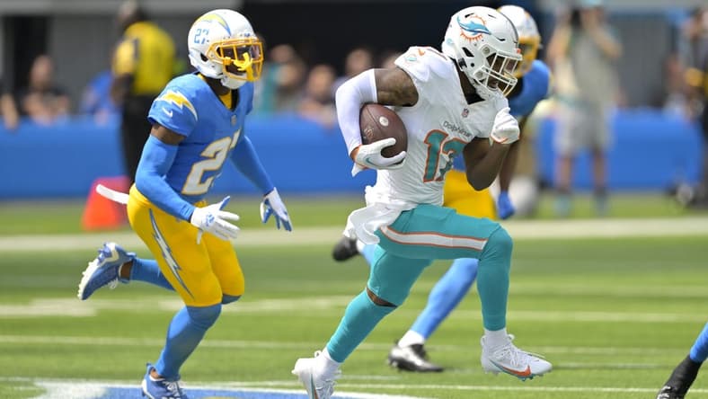 Sep 10, 2023; Inglewood, California, USA; Miami Dolphins wide receiver Jaylen Waddle (17) is chased down by Los Angeles Chargers cornerback J.C. Jackson (27) and safety Alohi Gilman (32) after a pass play in the first half at SoFi Stadium. Mandatory Credit: Jayne Kamin-Oncea-USA TODAY Sports