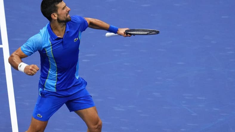 Sep 10, 2023; Flushing, NY, USA; Novak Djokovic of Serbia reacts after winning a point against Daniil Medvedev (not pictured) in the men's singles final in the men's singles final on day fourteen of the 2023 U.S. Open tennis tournament at USTA Billie Jean King National Tennis Center. Mandatory Credit: Danielle Parhizkaran-USA TODAY Sports
