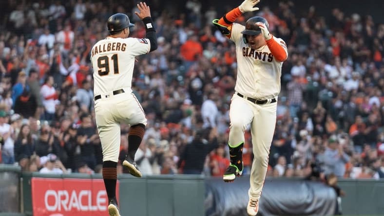 Sep 10, 2023; San Francisco, California, USA; San Francisco Giants designated hitter Joc Pederson (23) celebrates with third base coach Mark Hallberg (91) after hitting a solo home run during the fifth inning against the Colorado Rockies at Oracle Park. Mandatory Credit: Stan Szeto-USA TODAY Sports