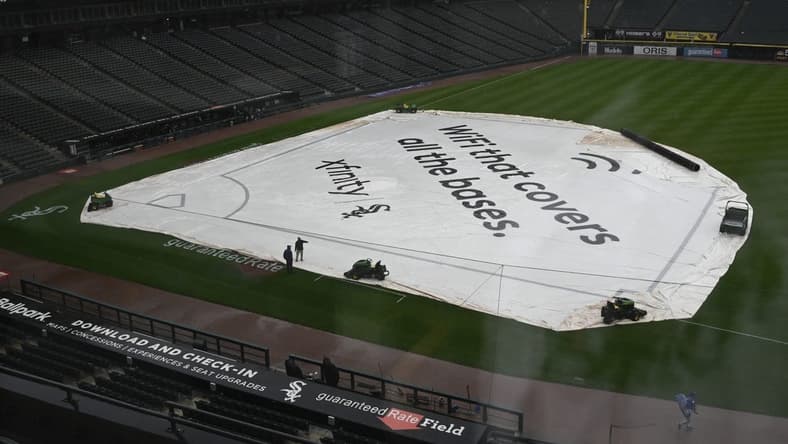 Sep 11, 2023; Chicago, Illinois, USA; A tarp covers the infield before game between the Kansas City Royals and the Chicago White Sox at Guaranteed Rate Field. The game was postponed due to rain until Tuesday. Mandatory Credit: Matt Marton-USA TODAY Sports