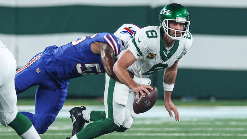 Sep 11, 2023; East Rutherford, New Jersey, USA; New York Jets quarterback Aaron Rodgers (8) is injured while being sacked by Buffalo Bills defensive end Leonard Floyd (56) during the first half at MetLife Stadium. Mandatory Credit: Vincent Carchietta-USA TODAY Sports