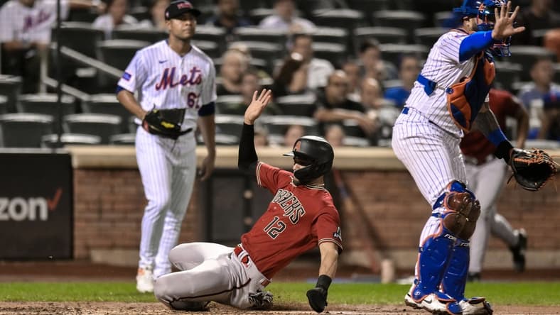 Sep 11, 2023; New York City, New York, USA; Arizona Diamondbacks left fielder Lourdes Gurriel Jr. (12) scores on a sacrifice fly hit by Arizona Diamondbacks third baseman Emmanuel Rivera (not pictured) during the fourth inning against the New York Mets at Citi Field. Mandatory Credit: John Jones-USA TODAY Sports