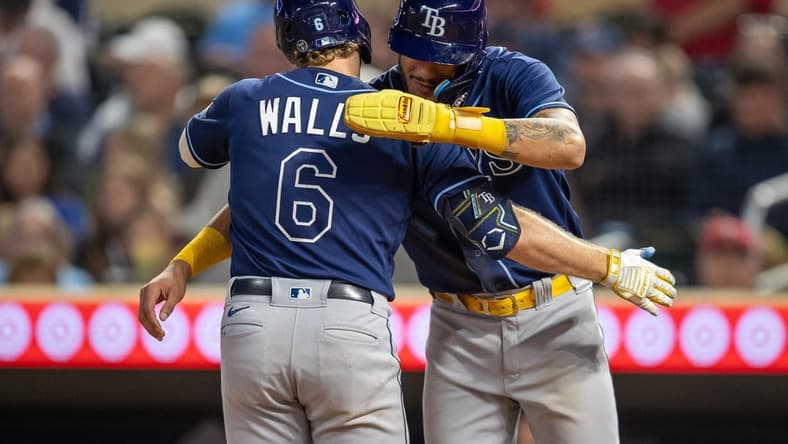 Sep 11, 2023; Minneapolis, Minnesota, USA; Tampa Bay Rays shortstop Taylor Walls (6) celebrates with center fielder Jose Siri (22) after hitting a three run home run against the Minnesota Twins in the fifth inning at Target Field. Mandatory Credit: Jesse Johnson-USA TODAY Sports