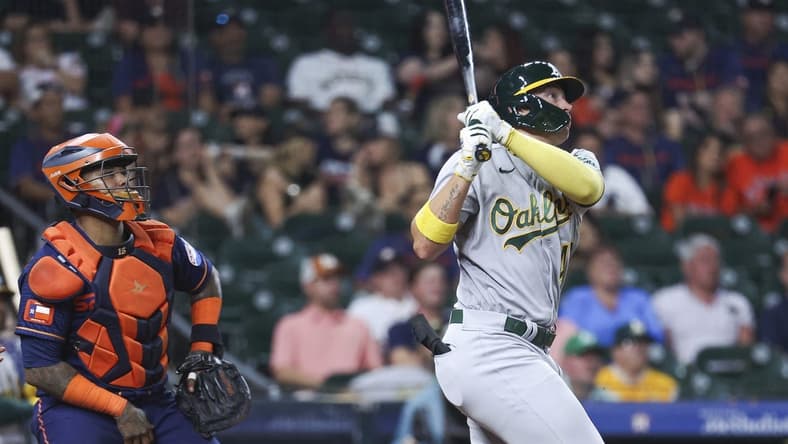 Sep 11, 2023; Houston, Texas, USA; Oakland Athletics first baseman Ryan Noda (49) hits a home run during the ninth inning against the Houston Astros at Minute Maid Park. Mandatory Credit: Troy Taormina-USA TODAY Sports