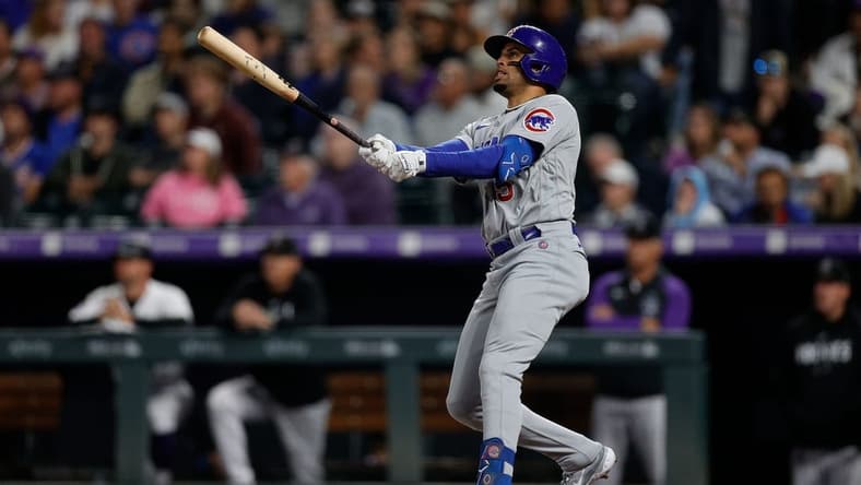 Sep 11, 2023; Denver, Colorado, USA; Chicago Cubs designated hitter Christopher Morel (5) watches his ball on a solo home run in the fifth inning against the Colorado Rockies at Coors Field. Mandatory Credit: Isaiah J. Downing-USA TODAY Sports