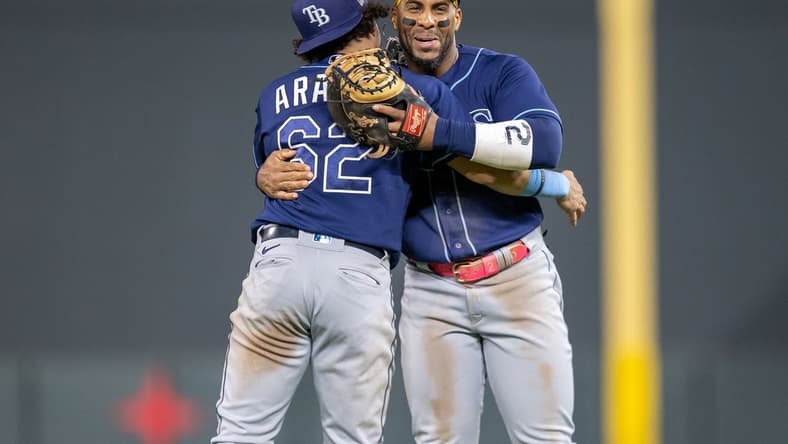 Sep 11, 2023; Minneapolis, Minnesota, USA; Tampa Bay Rays third baseman Jonathan Aranda (62) and first baseman Yandy Diaz (2) celebrate after defeating the Minnesota Twins at Target Field. Mandatory Credit: Jesse Johnson-USA TODAY Sports