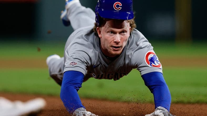 Sep 11, 2023; Denver, Colorado, USA; Chicago Cubs outfielder Pete Crow-Armstrong (52) attempts to steal third base in the seventh inning against the Colorado Rockies at Coors Field. Mandatory Credit: Isaiah J. Downing-USA TODAY Sports