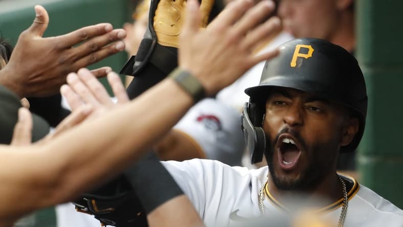 Sep 12, 2023; Pittsburgh, Pennsylvania, USA; Pittsburgh Pirates right fielder Joshua Palacios (54) receives high-fives in the dugout after hitting a two run home run against the Washington Nationals during the second inning at PNC Park. Mandatory Credit: Charles LeClaire-USA TODAY Sports